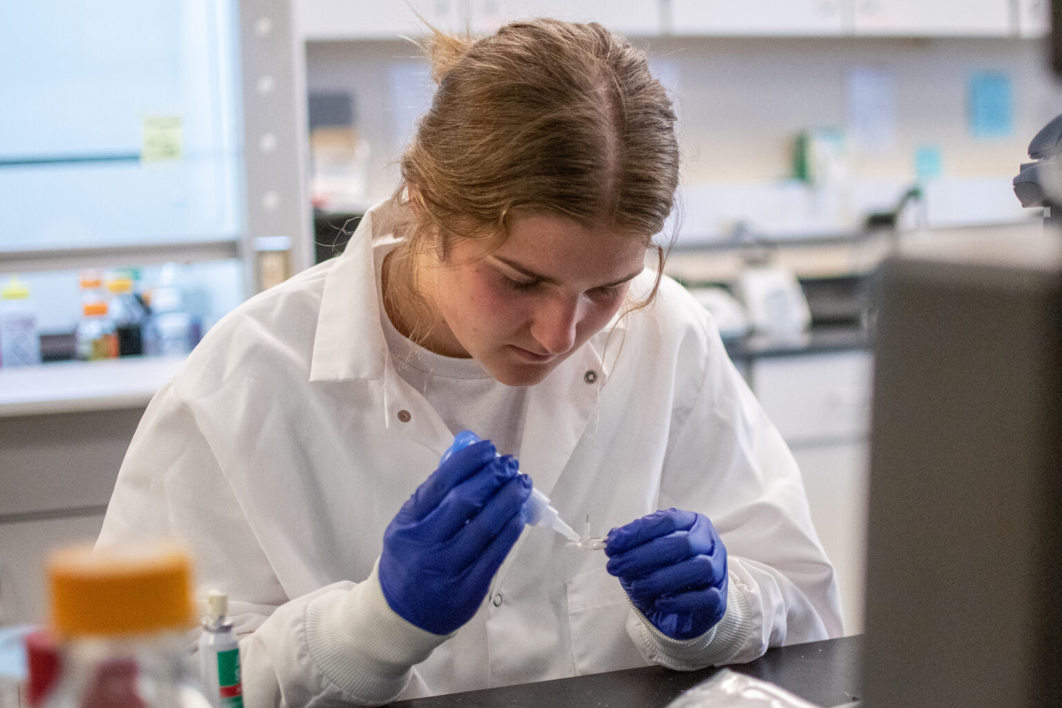 Student Gracie Berentson creates a catheter for her lab work.
