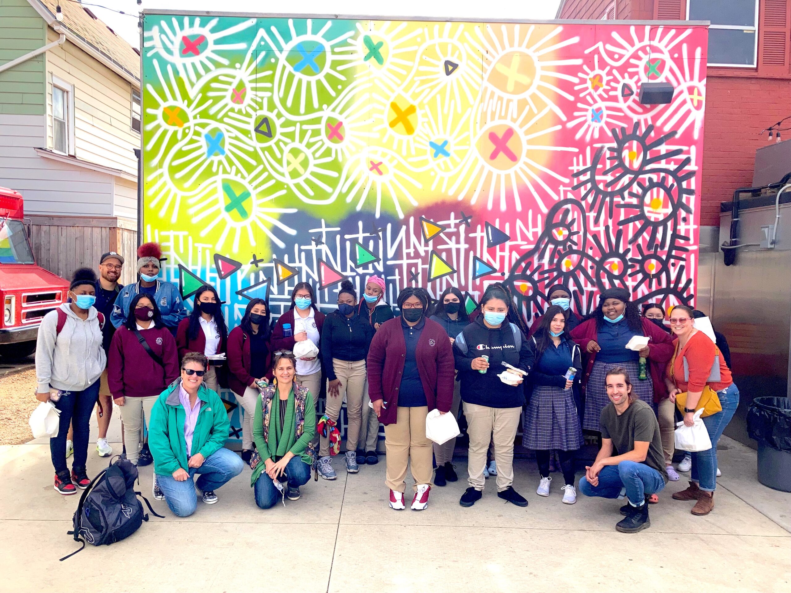Group of St. Joan Antida High School students at a local mural, part of the MKE Roots project.