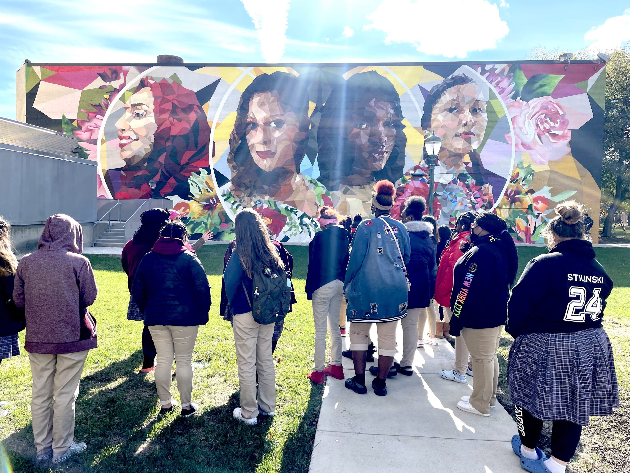 MKE Roots - Explore MKE. Students at Marquette mural.