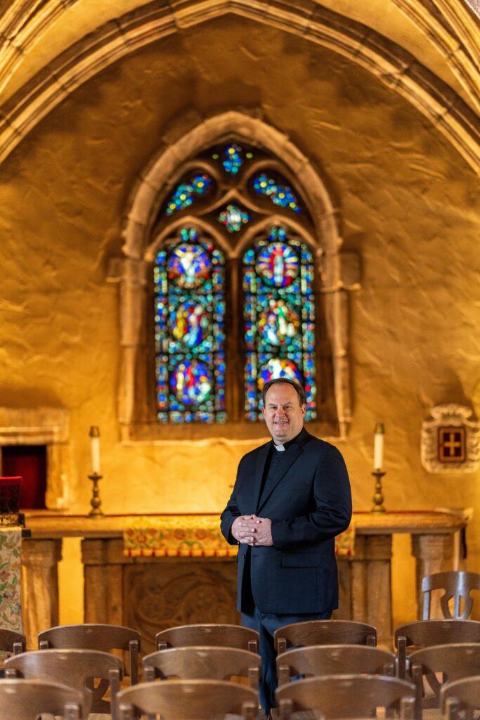 Rev. John Thiede, S.J., vice president for mission and ministry, stands in St. Joan of Arc Chapel. 