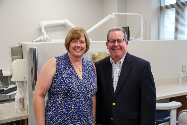 Carol and Brian Trecek stand in the dental clinic