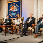 Acting President and Provost Dr. Kimo Ah Yun sits on a stage with the deans of business, engineering and law, along with Director of the Center for Real Estate Andy Hunt, at the 2024 Real Estate Strategies Conference.