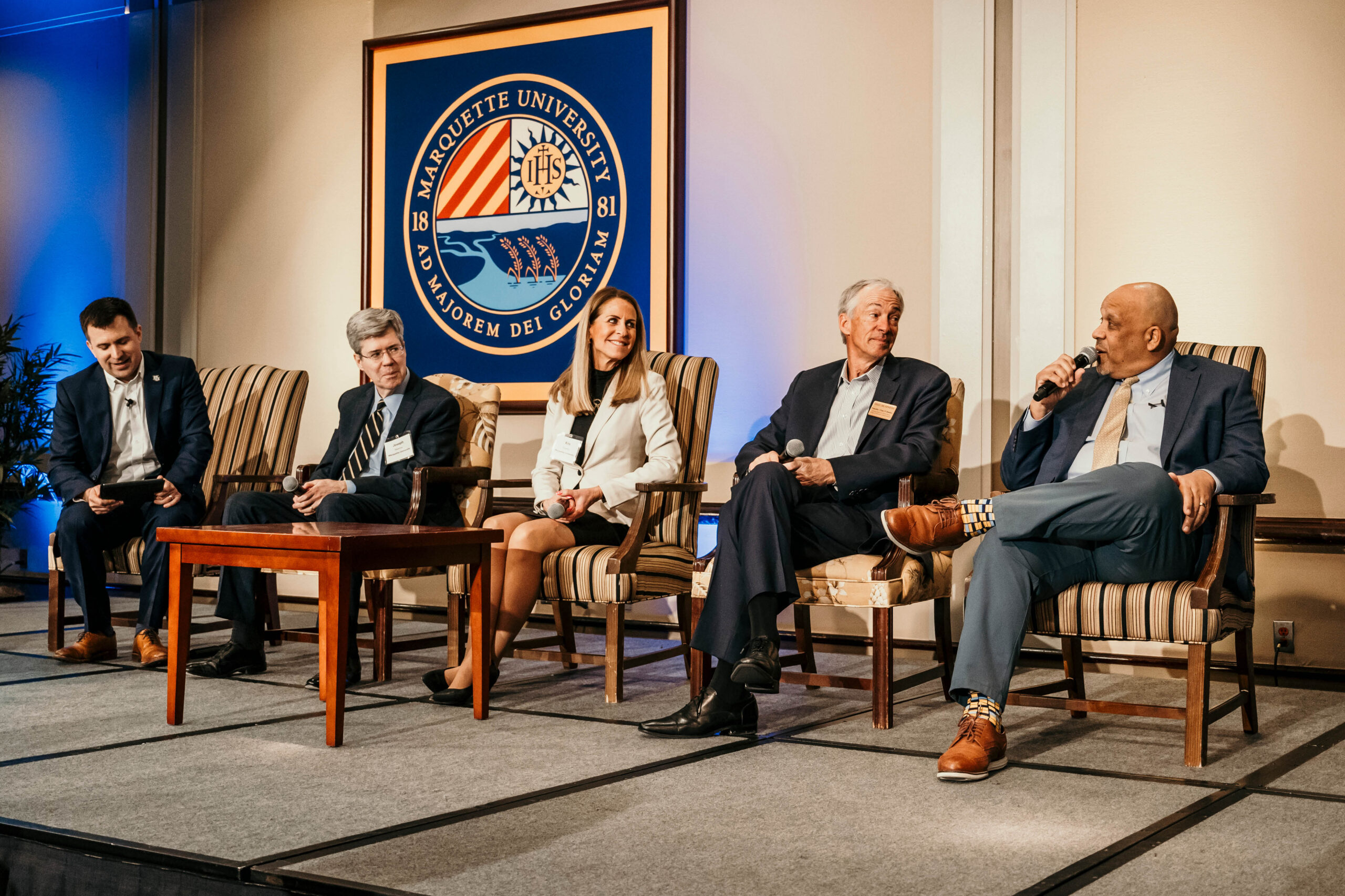 Acting President and Provost Dr. Kimo Ah Yun sits on a stage with the deans of business, engineering and law, along with Director of the Center for Real Estate Andy Hunt, at the 2024 Real Estate Strategies Conference.