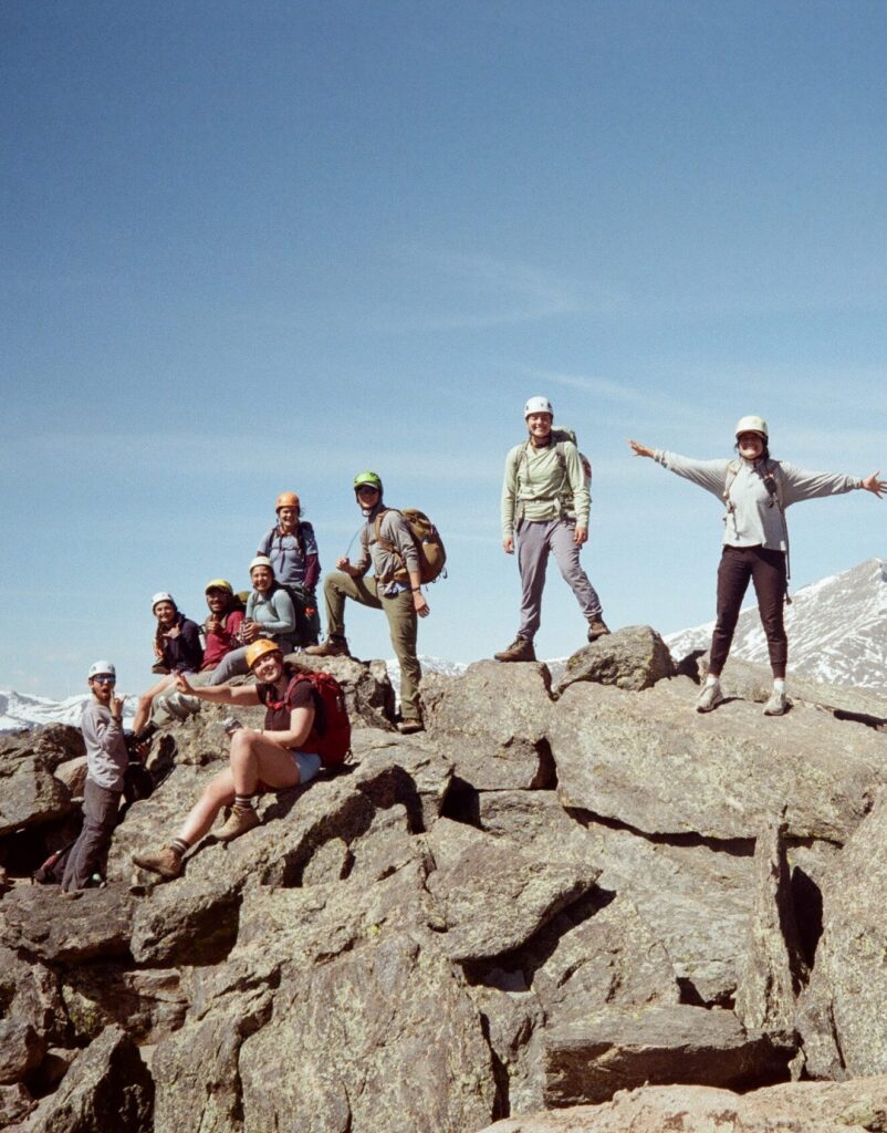 Elise Raschke summiting a mountain