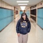 Student Jasmin Prado standing int he hallway at her school