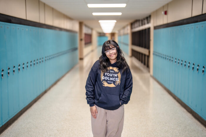 Student Jasmin Prado standing int he hallway at her school