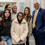 President Kimo Ah Yun poses with a group of Marquette students.