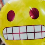 A balloon designed to look like the "awkward face" emoji.