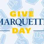 A graphic with text that says "Give Marquette Day" in front of foam fingers.