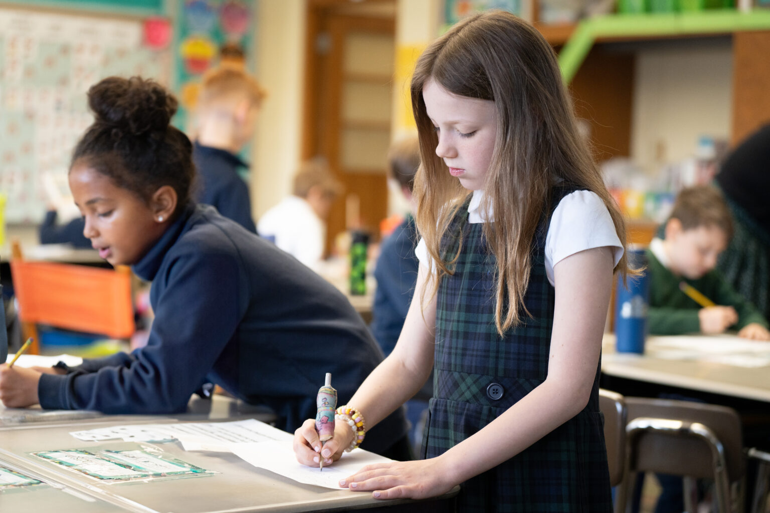 Two elementary school girls at St. Robert school.
