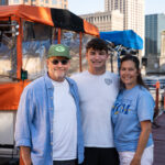The Kraus family stands on a dock.