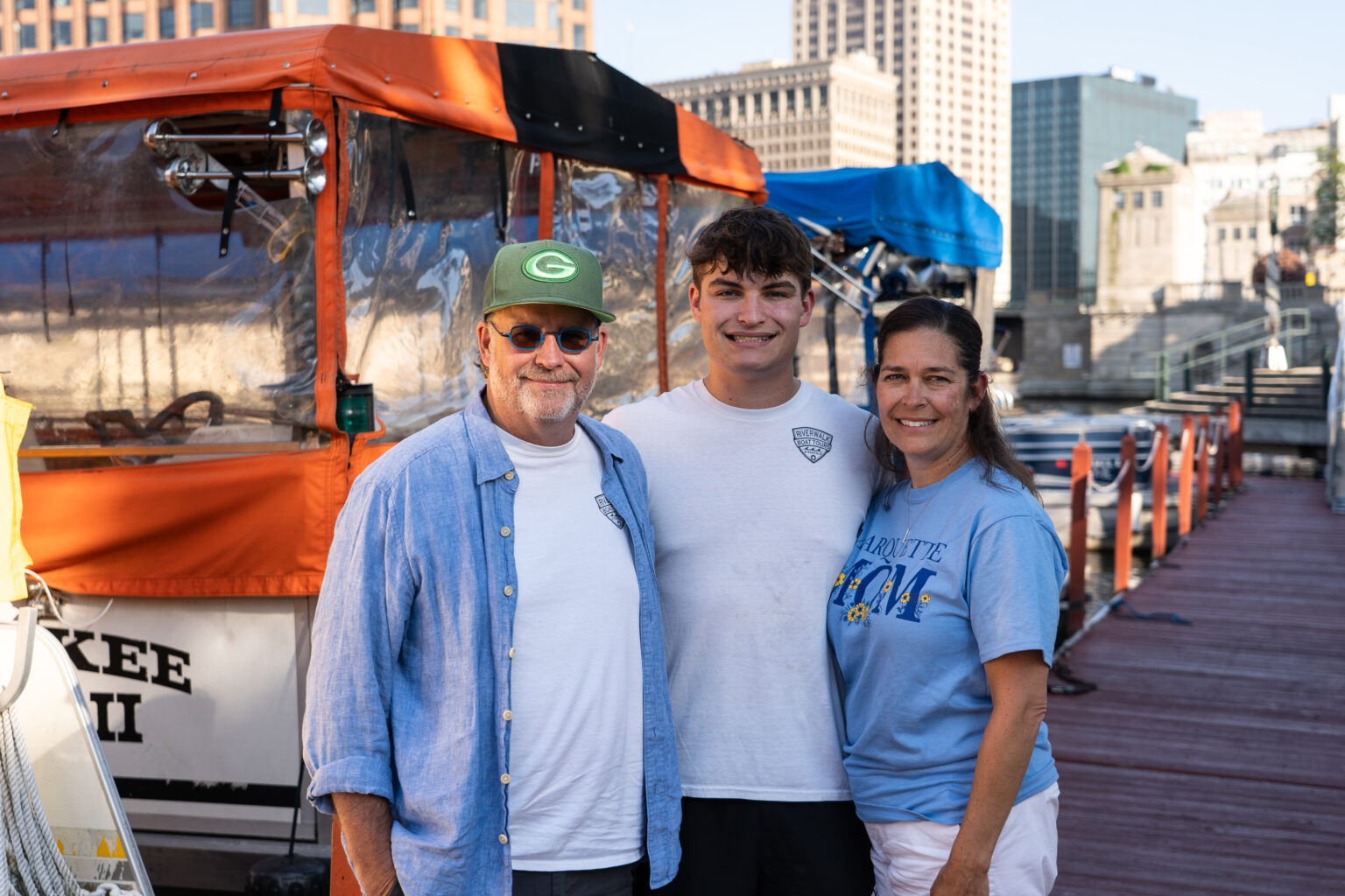 The Kraus family stands on a dock.