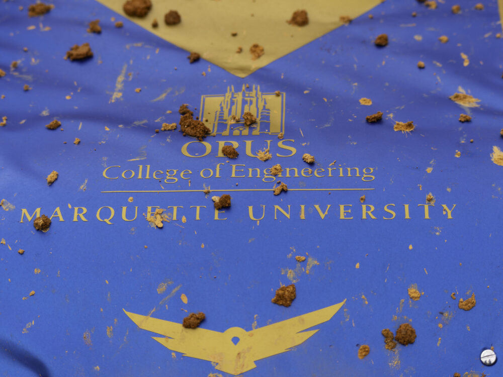 hood of off-road racing vehicle with Marquette Opus College of Engineering logo