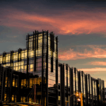 Large glass building at dusk