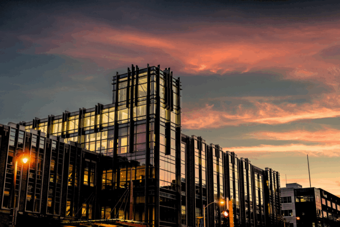 Large glass building at dusk