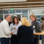 Marquette Business students, faculty, and alumni networking at event