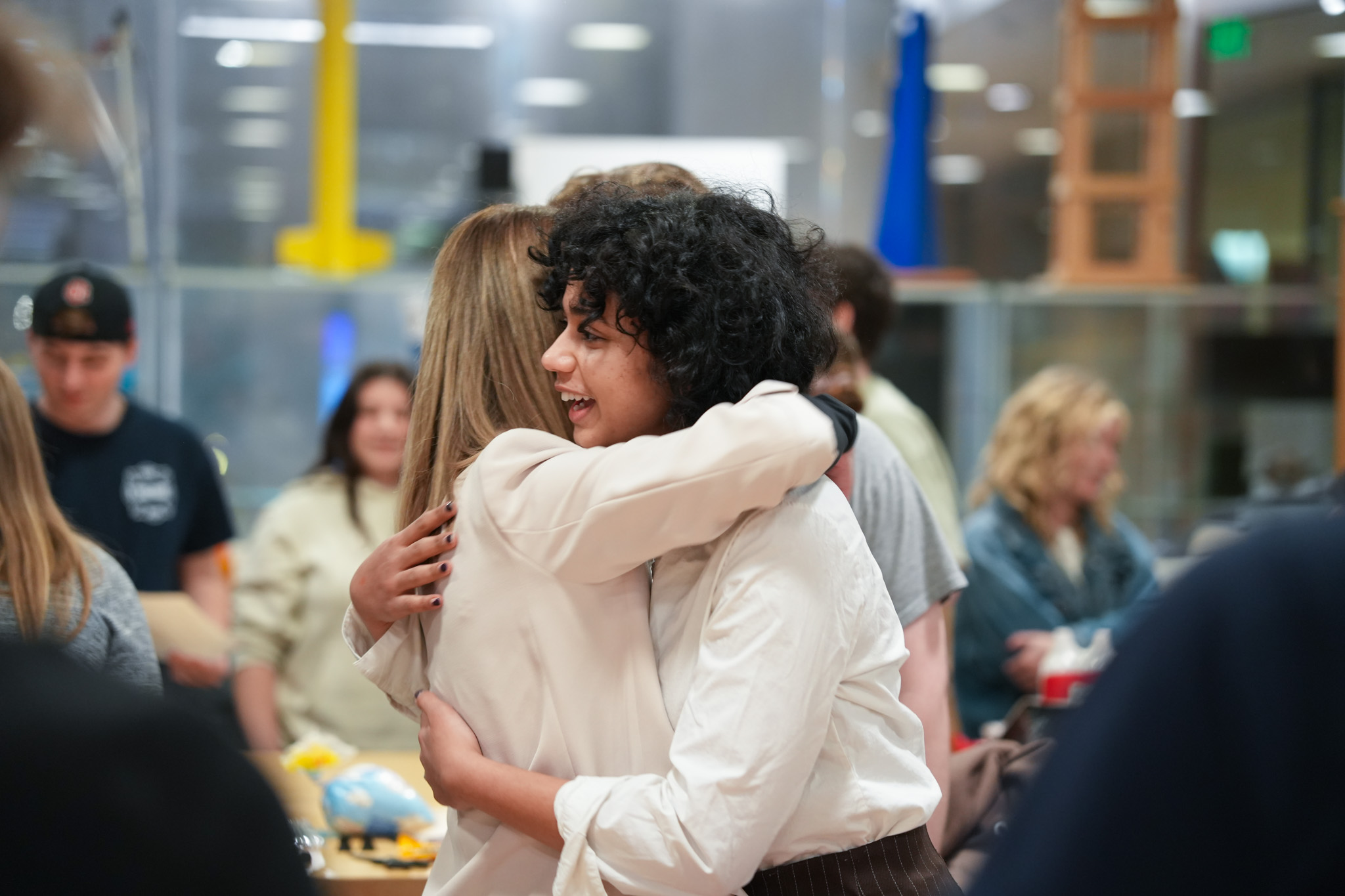 Dean and student hugging