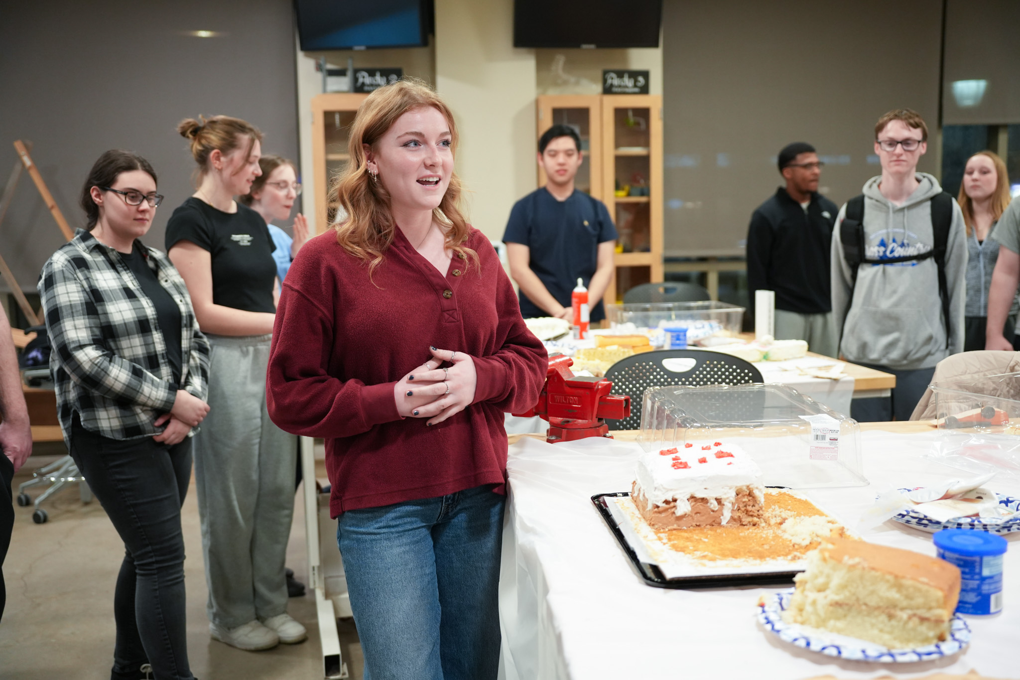 student presenting a Minecraft cake at cake decorating contest