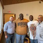 Peter Battaglia and some clergy members