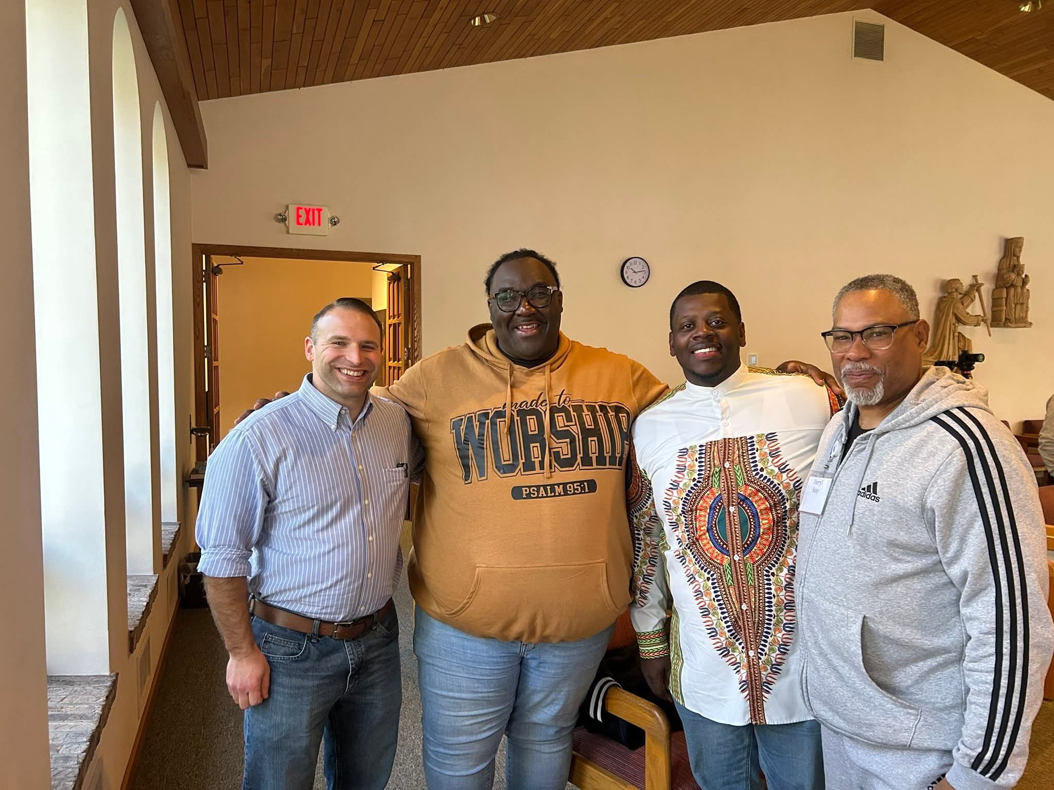 Peter Battaglia and some clergy members