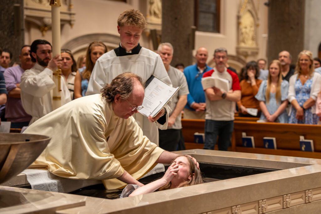 Maddie Janecek getting baptized