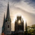 The sun peaking through Marquette Tower.