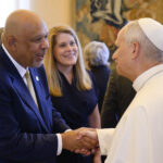 President Kimo Ah Yun shaking Pope Leo's hand.