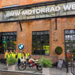 Marquette students posing in front of BMW Motorrad Welt site in Germany