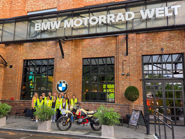 Marquette students posing in front of BMW Motorrad Welt site in Germany