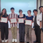 Marquette students and clinicians from Manila posing with certificates in a presentation room
