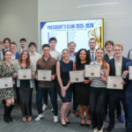 Marquette sales students pose for group photo with end-of-year banquet certificates