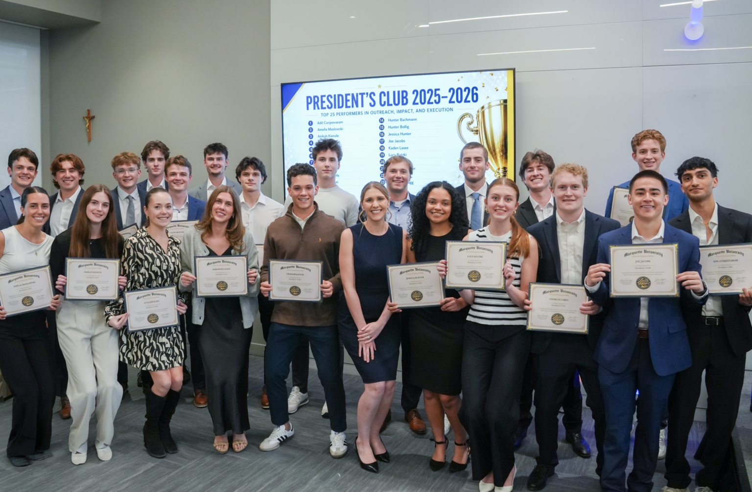 Marquette sales students pose for group photo with end-of-year banquet certificates