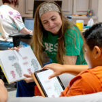 A student in the Bilingual English-Spanish specialization instructing a client.